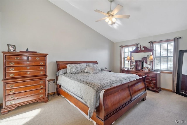 bedroom with lofted ceiling, light colored carpet, baseboards, and ceiling fan