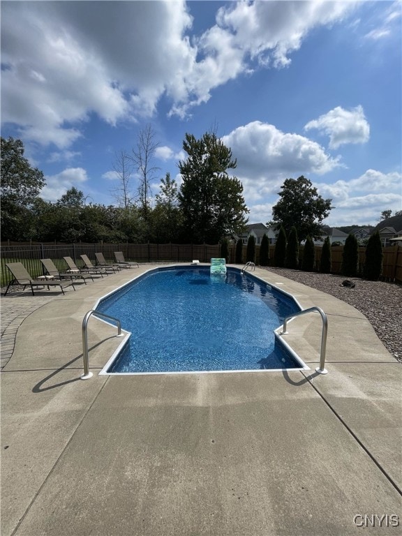 view of pool with a fenced in pool, a patio, and fence