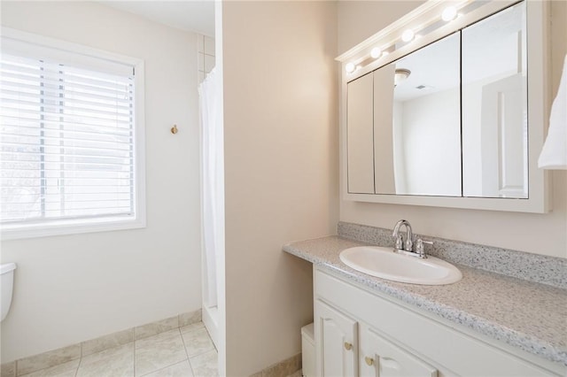 bathroom featuring tile patterned flooring, curtained shower, toilet, and vanity