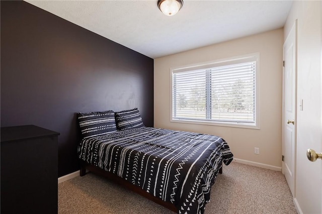 carpeted bedroom with baseboards