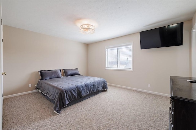 carpeted bedroom with baseboards