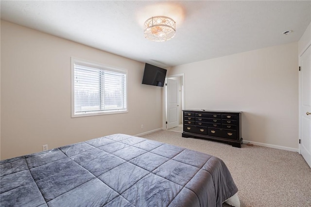 carpeted bedroom with baseboards