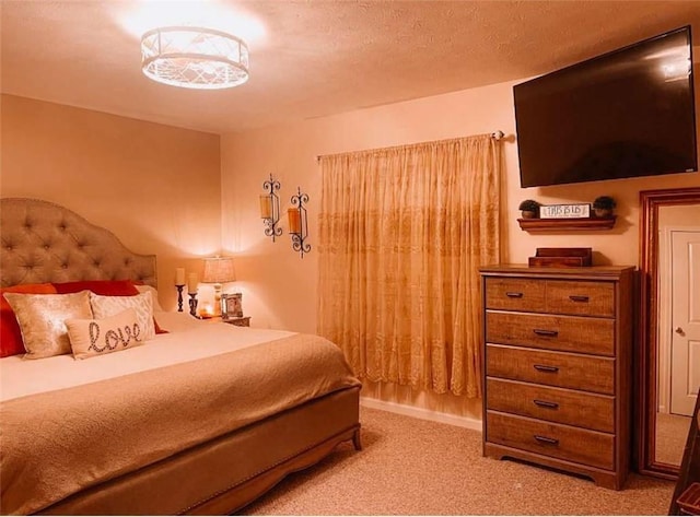 bedroom featuring light colored carpet and a textured ceiling