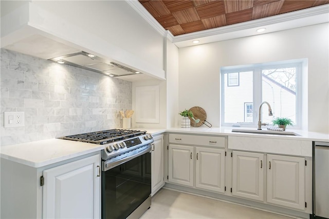 kitchen featuring a sink, decorative backsplash, ornamental molding, light countertops, and stainless steel appliances