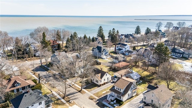 bird's eye view with a residential view and a water view