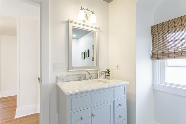 bathroom featuring vanity and wood finished floors