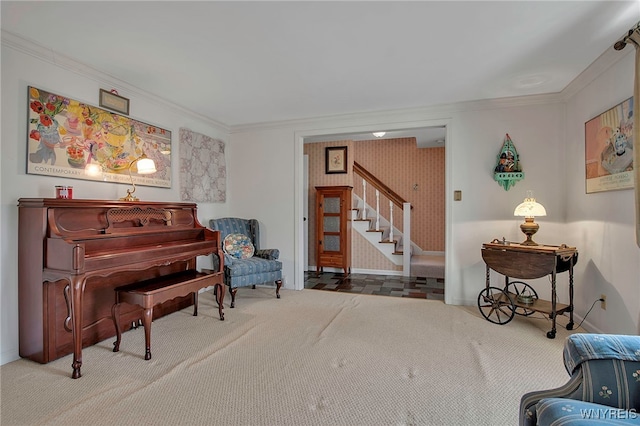 living area featuring carpet flooring, crown molding, stairs, and baseboards