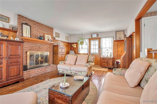 living room with a fireplace and hardwood / wood-style flooring