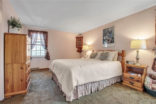 bedroom with visible vents and carpet