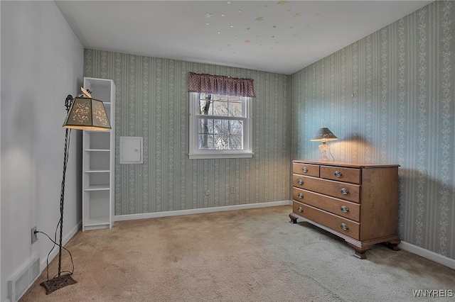 bedroom with visible vents, baseboards, carpet flooring, and wallpapered walls