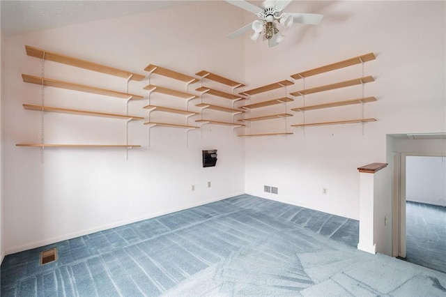 spare room with visible vents, carpet, and ceiling fan