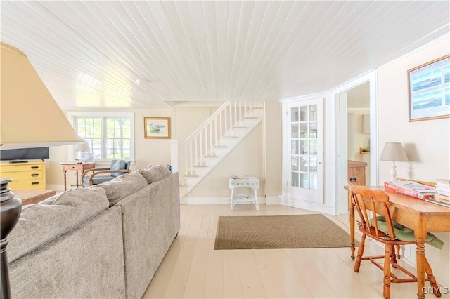 living area with stairway, wood ceiling, and wood finished floors