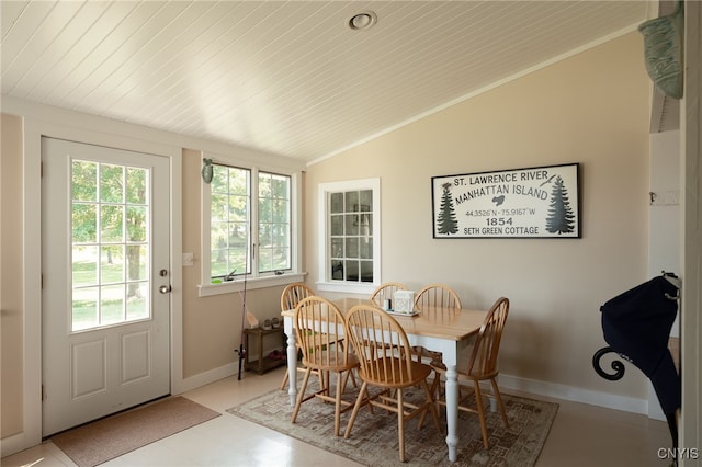 dining room featuring wooden ceiling, baseboards, and lofted ceiling