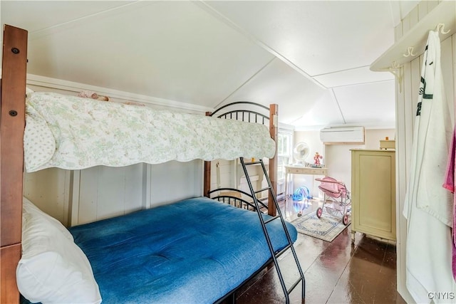 bedroom featuring lofted ceiling and a wall mounted AC