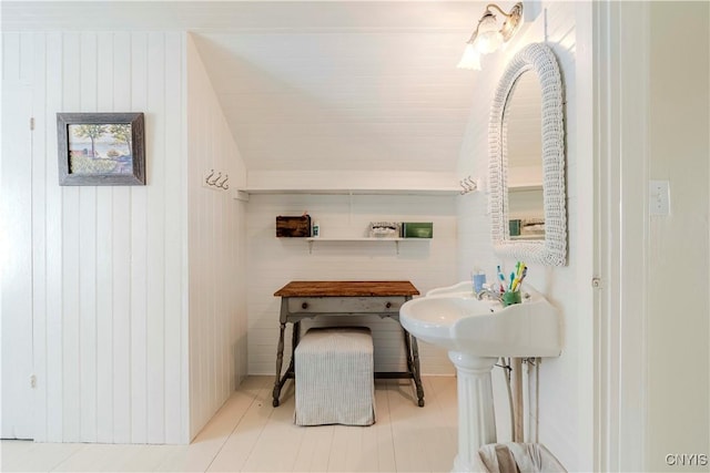 bathroom with lofted ceiling