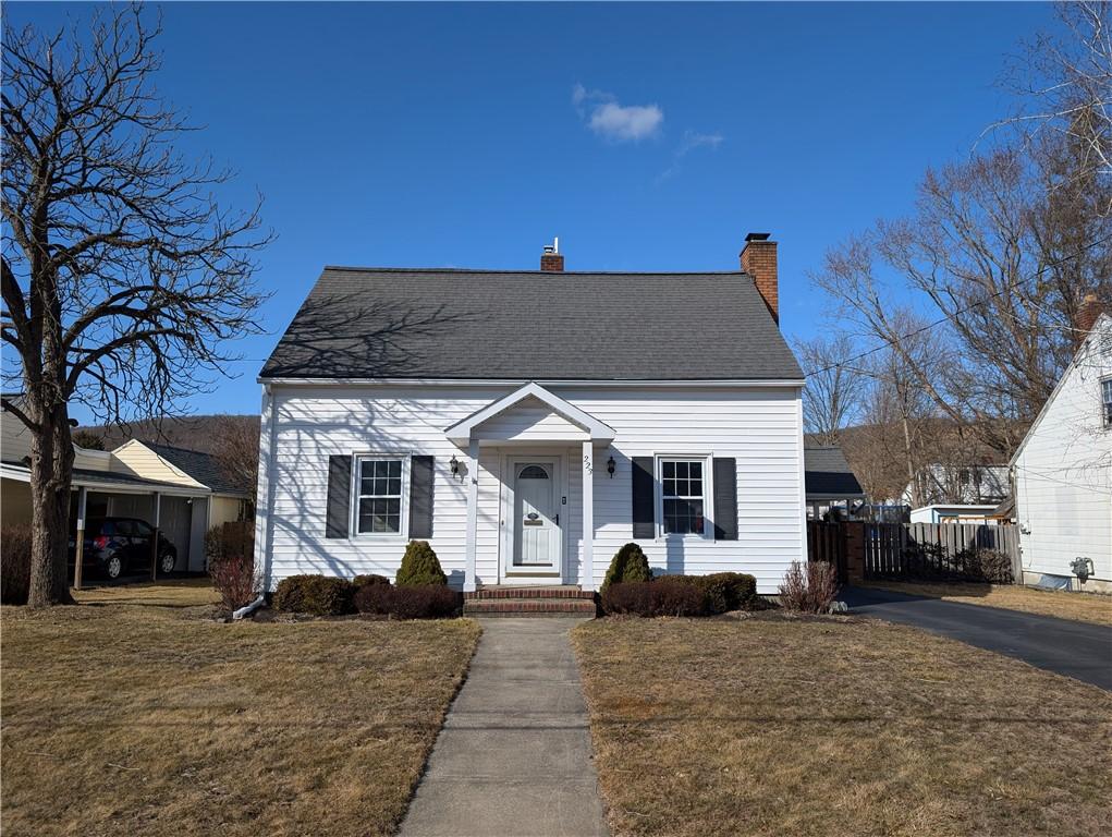223 Onondaga St, Corning City, NY 14830 - view of front facade with a chimney, a front yard, and fence