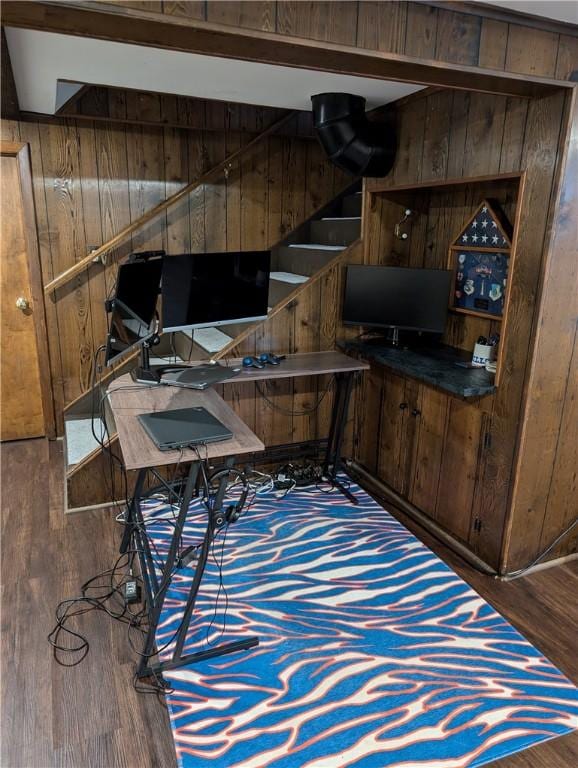 office area featuring wood finished floors and wood walls