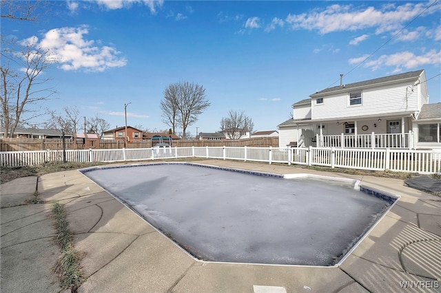 view of pool featuring a fenced in pool, a patio, a residential view, and a fenced backyard