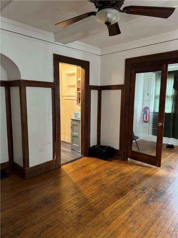 empty room with french doors, hardwood / wood-style floors, and crown molding