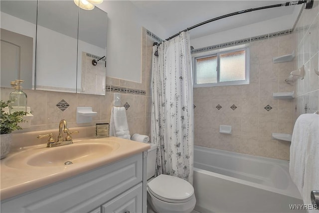 bathroom featuring vanity, decorative backsplash, shower / bath combination with curtain, tile walls, and toilet