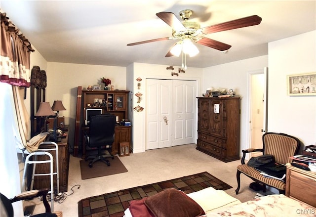 office area with carpet floors and ceiling fan