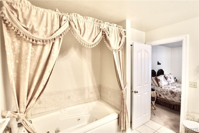 full bathroom featuring tile patterned floors, a jetted tub, and ensuite bath