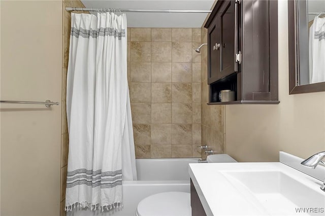 bathroom with vanity, toilet, and shower / tub combo