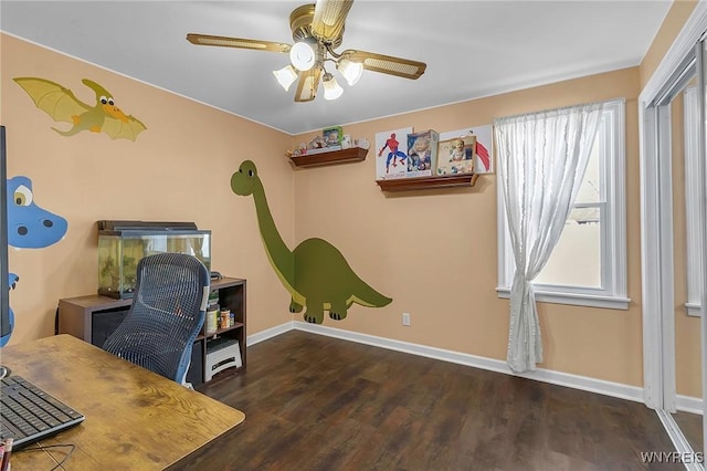 office featuring a ceiling fan, wood finished floors, and baseboards