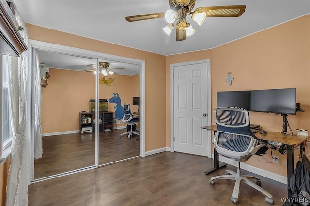 office with a ceiling fan, baseboards, and wood finished floors