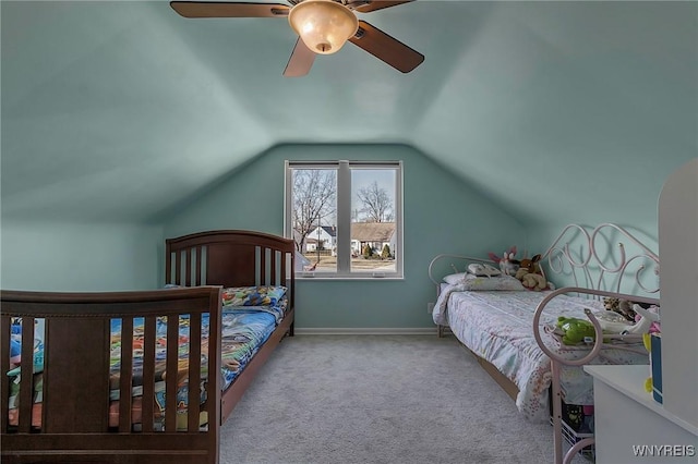 bedroom featuring baseboards, lofted ceiling, a ceiling fan, and carpet flooring