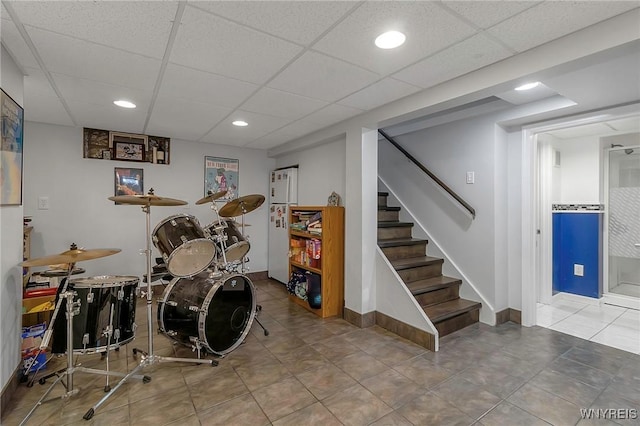 playroom with tile patterned flooring, recessed lighting, a paneled ceiling, and baseboards