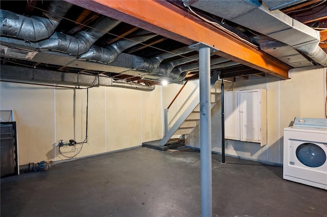 unfinished basement with washer / clothes dryer and stairs