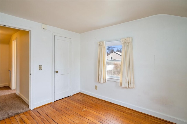 unfurnished bedroom featuring baseboards and light wood finished floors