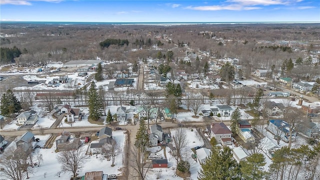 snowy aerial view featuring a residential view