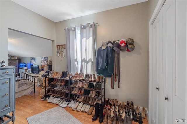 bedroom with a closet and light wood finished floors