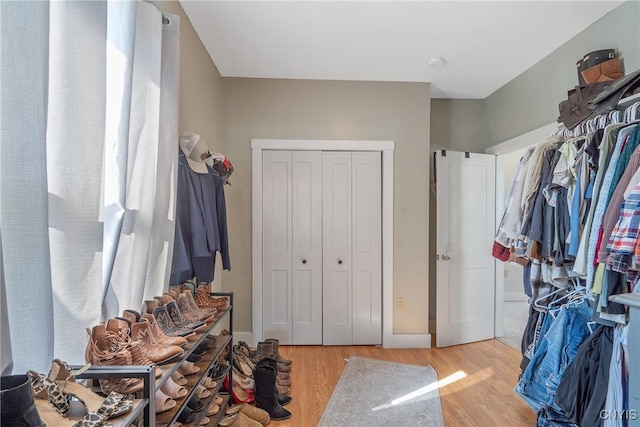 spacious closet featuring light wood-type flooring