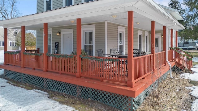 wooden deck featuring covered porch