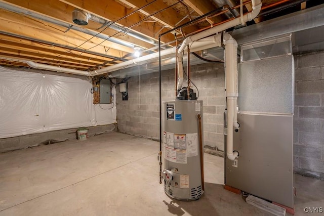 unfinished basement featuring gas water heater, heating unit, and electric panel