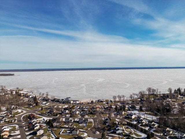 drone / aerial view featuring a residential view and a water view