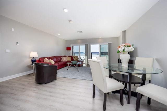 dining space featuring recessed lighting, light wood-type flooring, baseboards, and visible vents