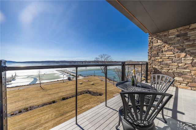 balcony featuring a water view