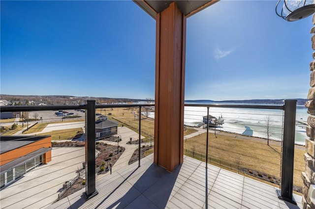 balcony featuring a water view