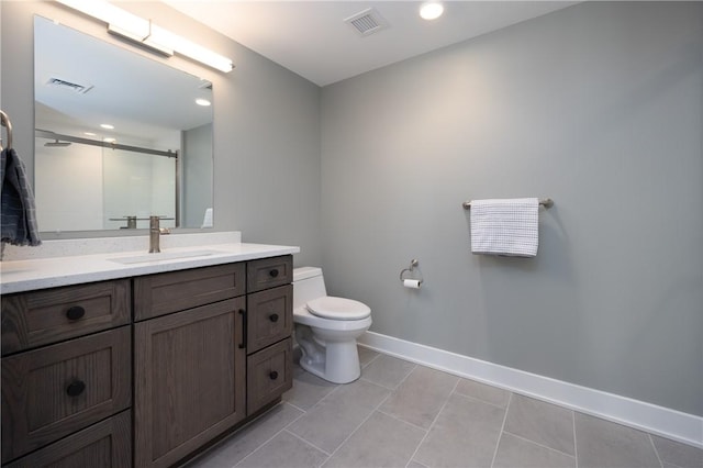 bathroom featuring visible vents, a stall shower, toilet, and baseboards