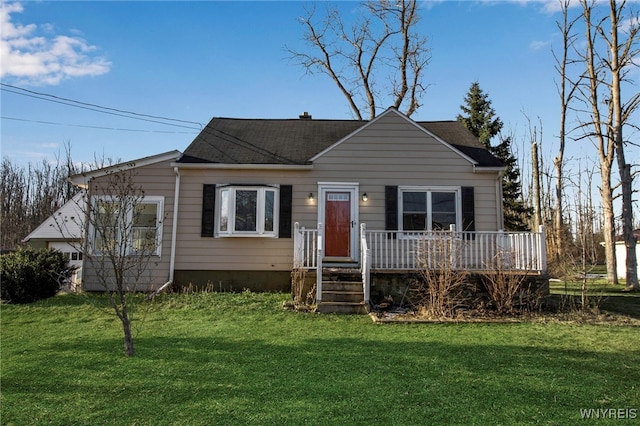 bungalow featuring a deck and a front yard