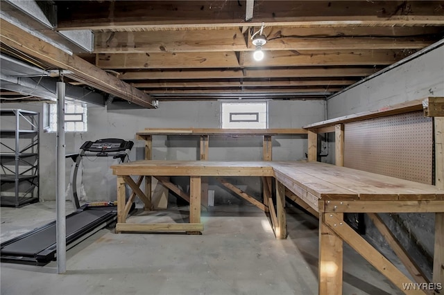 basement with a workshop area and a wealth of natural light