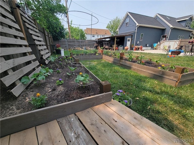 view of yard featuring a vegetable garden and a fenced backyard