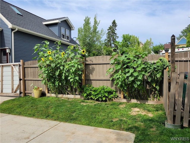 view of yard with a fenced backyard