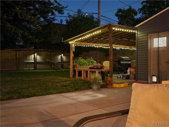 view of patio with area for grilling, fence private yard, and a pergola