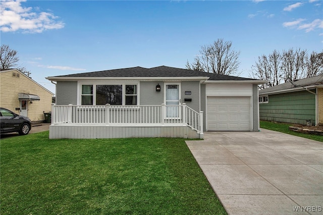 view of front of house with a front lawn, driveway, covered porch, an attached garage, and brick siding