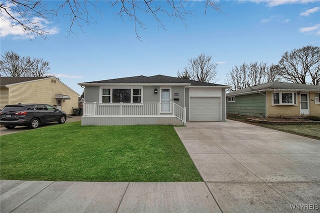 view of front of house featuring driveway, a front lawn, covered porch, a garage, and brick siding